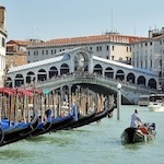 Gondolier on a Canal in Venice, Italy